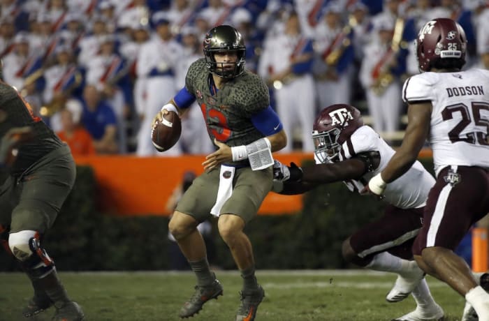 Oct 14, 2017; Gainesville, FL, USA;Florida Gators quarterback Feleipe Franks (13) runs out of the pocket as Texas A&M Aggies defensive end Michael Clemons (48) pressures during the first half at Ben Hill Griffin Stadium. Mandatory Credit: Kim Klement-USA TODAY Sports
